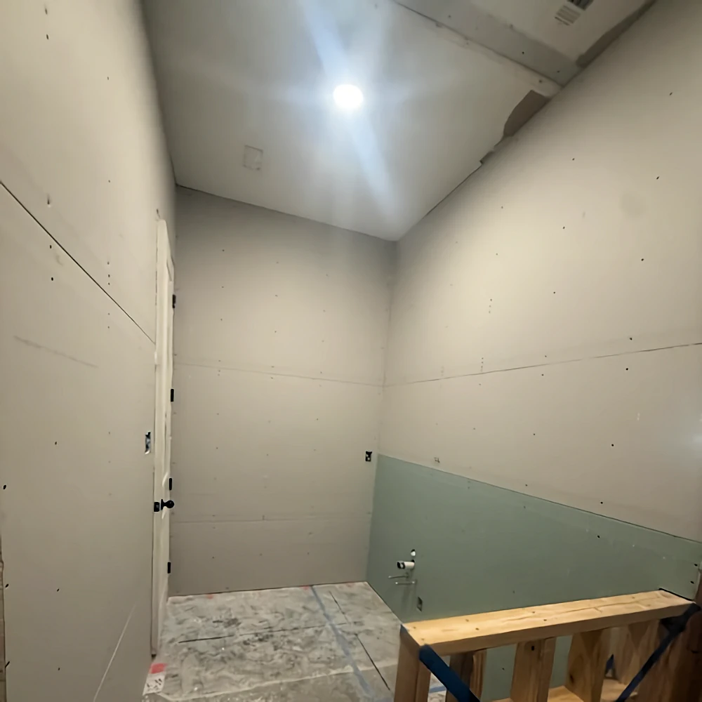 Second view of the bathroom with new drywall.